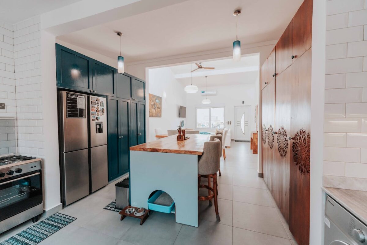 Spacious and stylish kitchen featuring a central island and modern design elements.